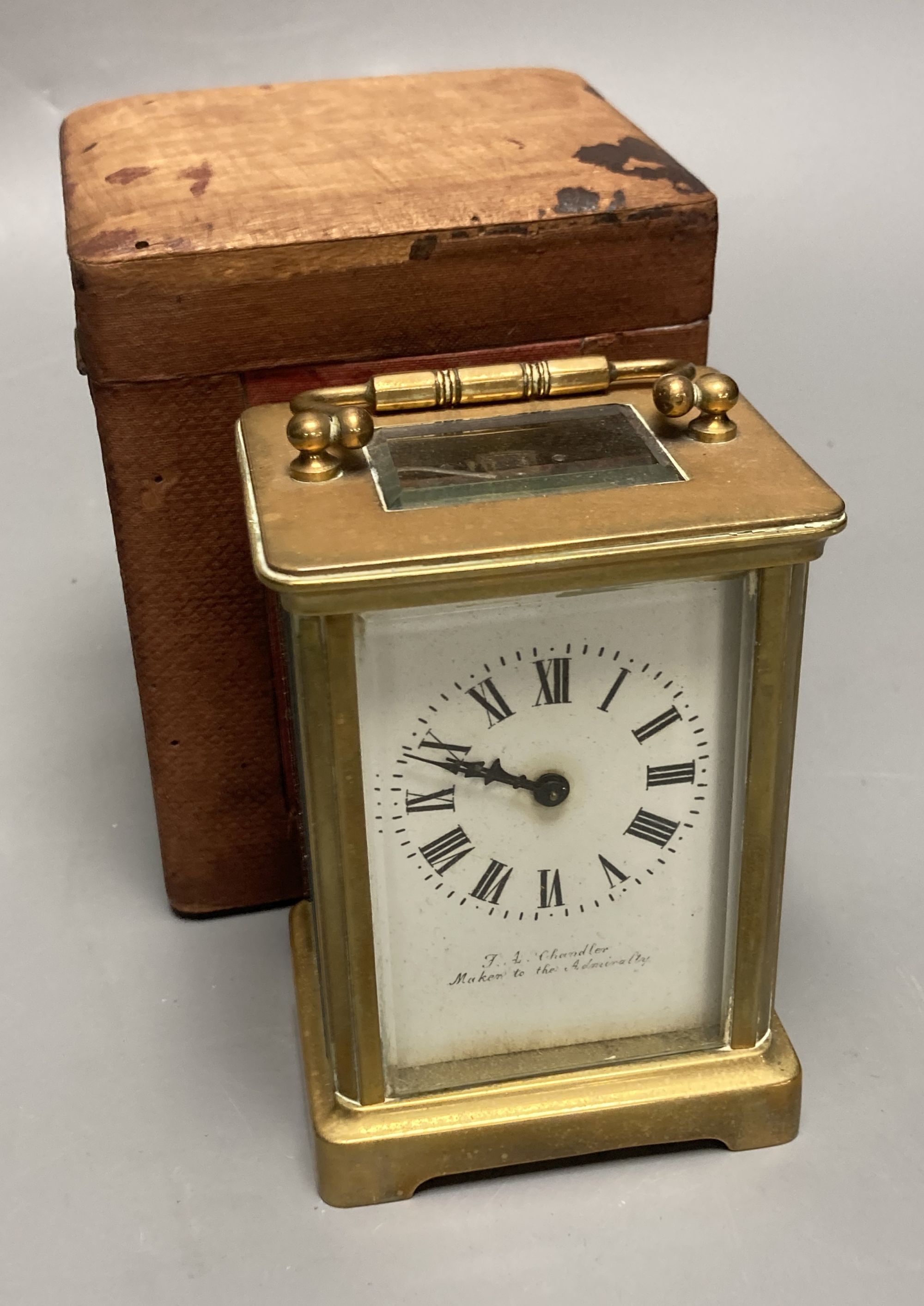 A French brass carriage timepiece, by F.L. Chandler, height 11cm, box 13cm